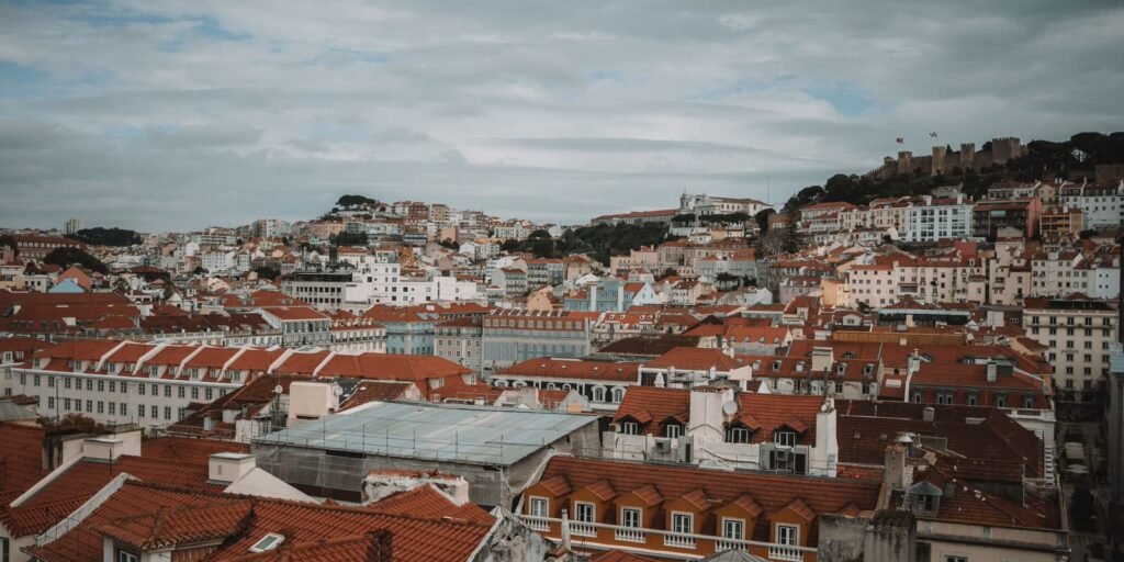 Panoramic view of Lisbon rooftops and the castle