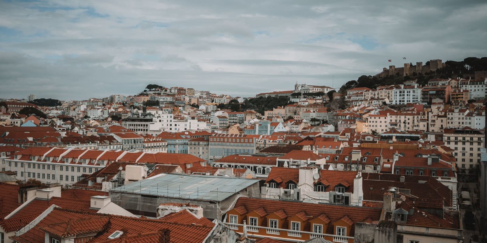 Panoramic view of Lisbon rooftops and the castle