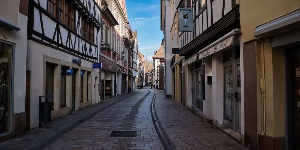 Cobblestone street with traditional buildings in Germany